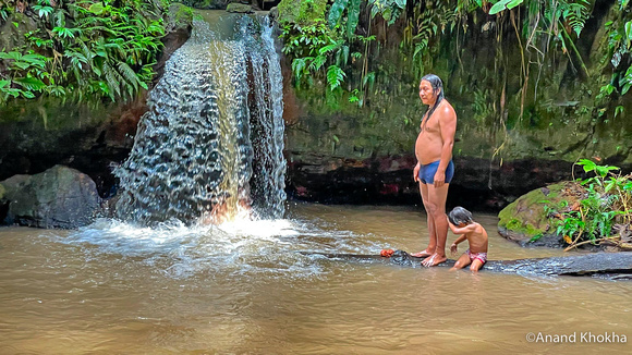 Manari and his son at the Waterfall Ceremony