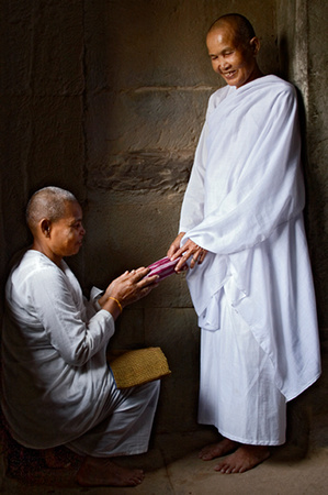 Nun receiving blessings, Angkor Wat, Cambdia